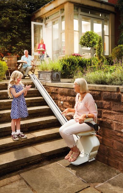Woman enjoying the outdoors with her outdoor stairlifts